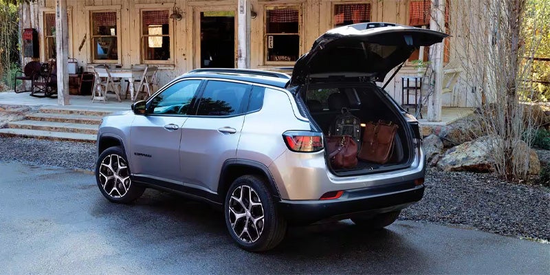 The rear of a 2025 Jeep Compass with the back hatch open