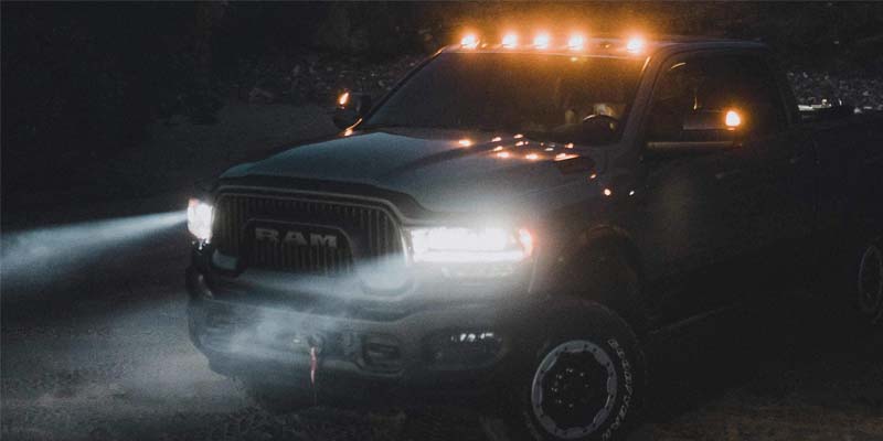 a 2024 Ram 2500 at night parked with lights on